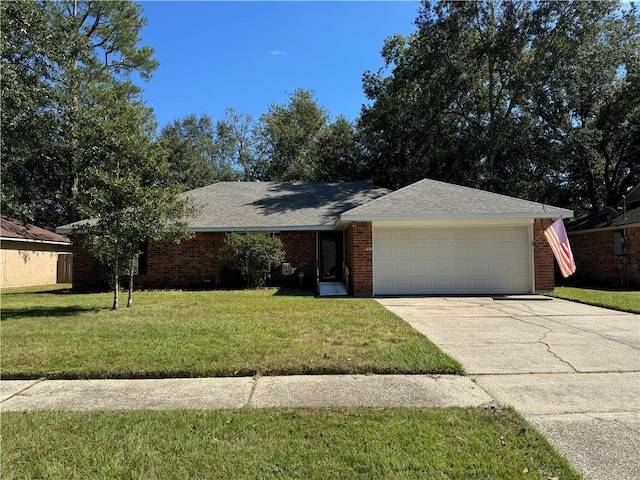 ranch-style home with a garage and a front yard