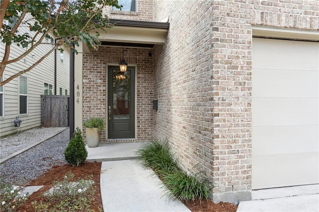 view of exterior entry with a garage