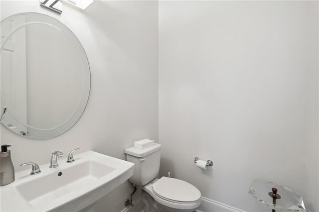 bathroom with toilet and sink