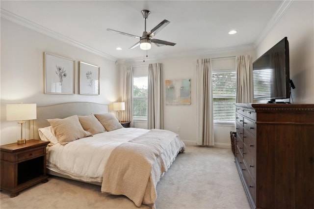 carpeted bedroom featuring ceiling fan and ornamental molding