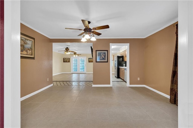 empty room with crown molding, light tile patterned floors, and ceiling fan