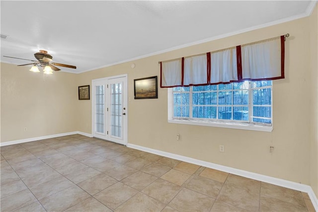 tiled empty room with ceiling fan, ornamental molding, and plenty of natural light