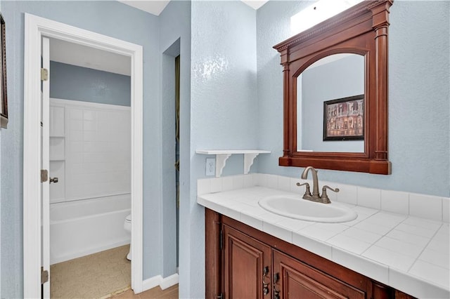 full bathroom with toilet, shower / washtub combination, and vanity