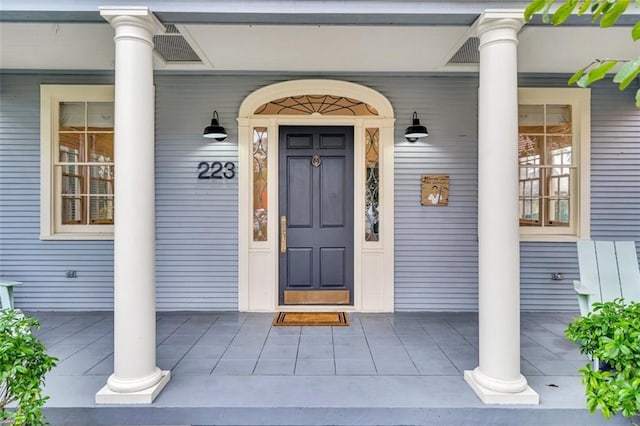 doorway to property with a porch