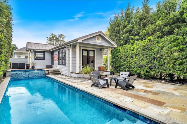 view of swimming pool with a patio area