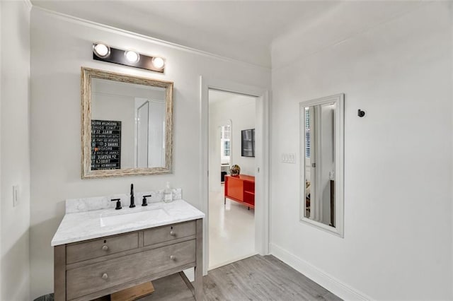 bathroom featuring vanity and wood-type flooring