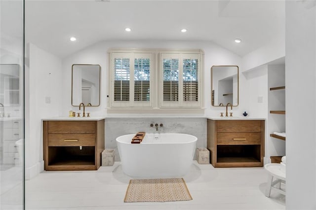 bathroom with wood-type flooring, plus walk in shower, built in features, lofted ceiling, and vanity