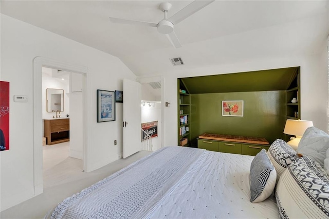 bedroom with connected bathroom, lofted ceiling, sink, light colored carpet, and ceiling fan