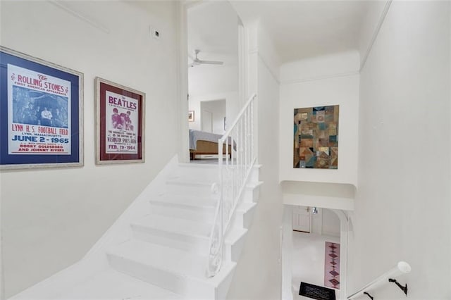 stairs with ceiling fan