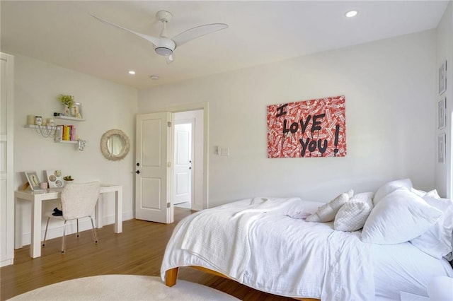 bedroom featuring dark hardwood / wood-style floors and ceiling fan