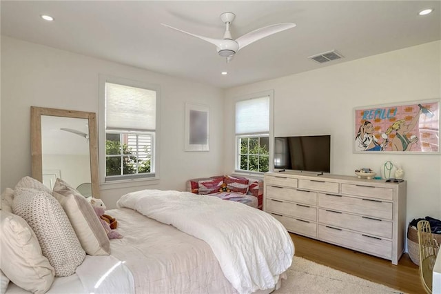 bedroom with dark wood-type flooring and ceiling fan