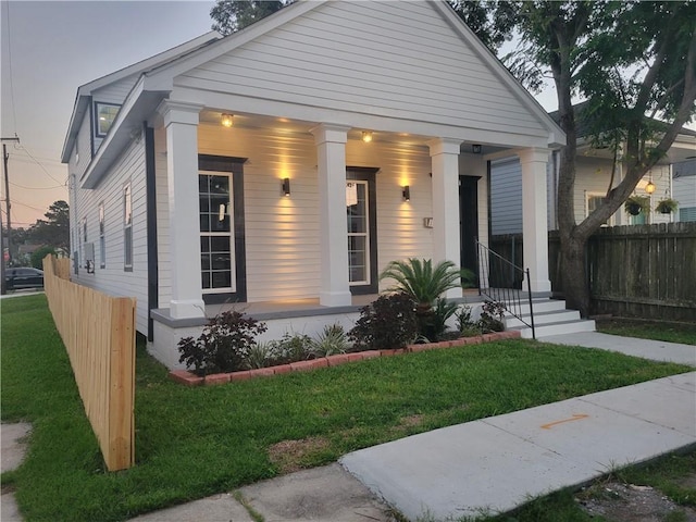 view of front of home with a yard