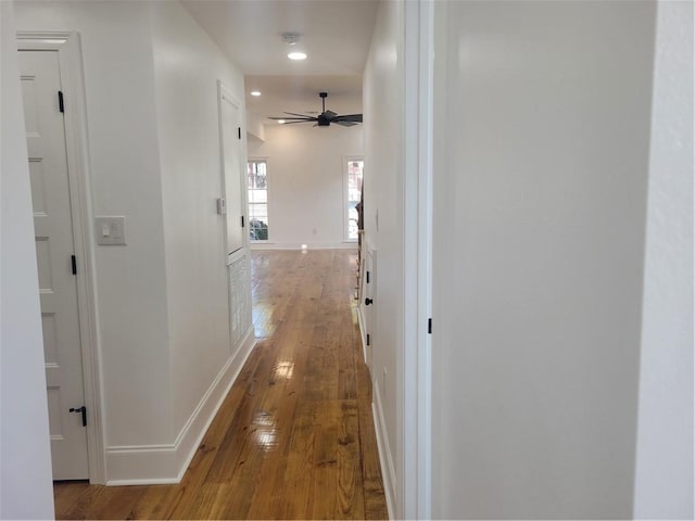 corridor with wood-type flooring