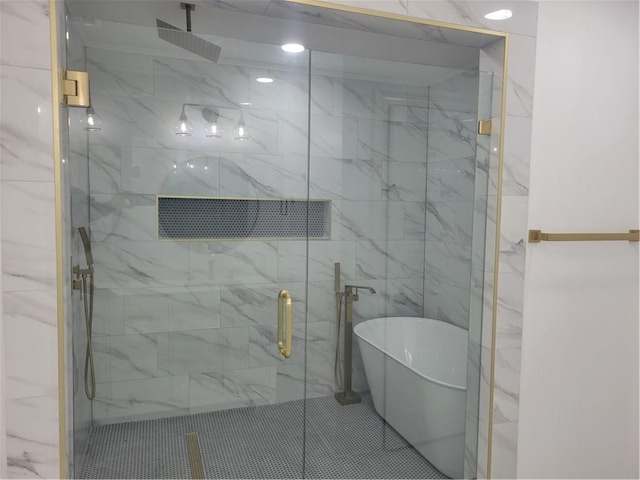 bathroom with shower with separate bathtub