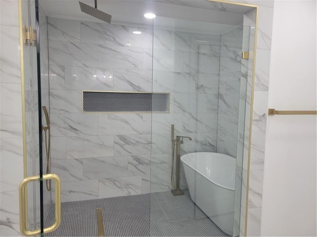 bathroom featuring shower with separate bathtub