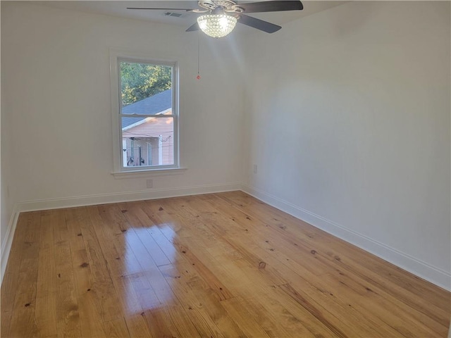 empty room with light hardwood / wood-style floors and ceiling fan