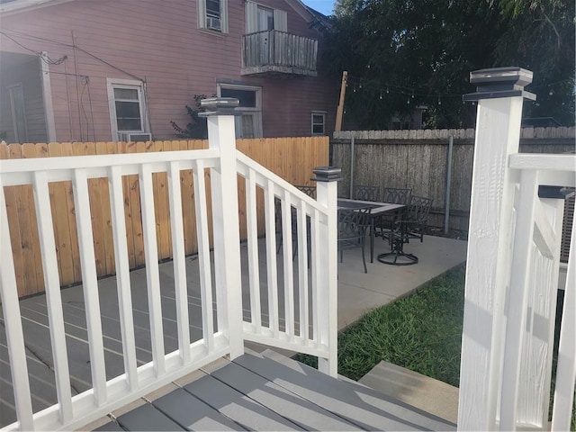 wooden terrace with a patio