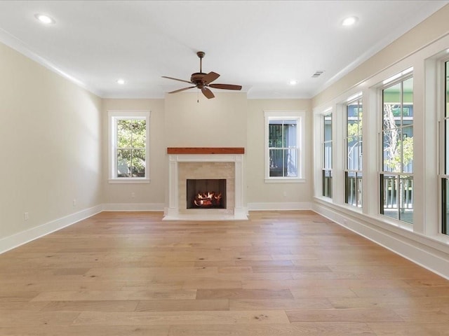 unfurnished living room featuring recessed lighting, a fireplace, visible vents, baseboards, and light wood finished floors