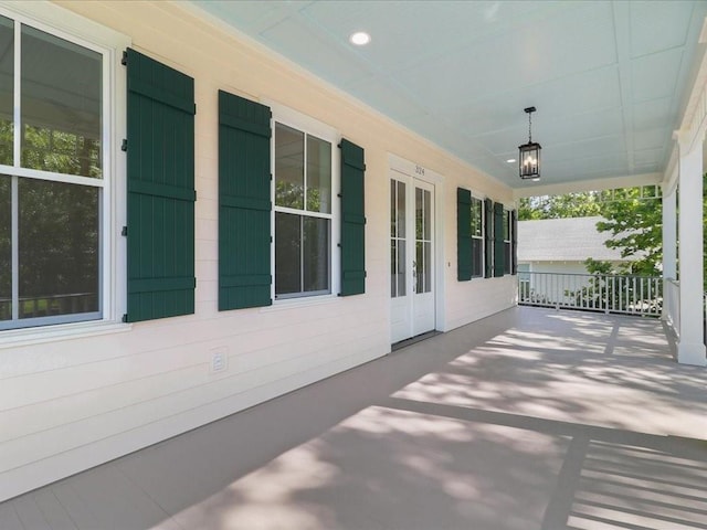 view of patio with covered porch and french doors