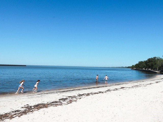 property view of water featuring a beach view