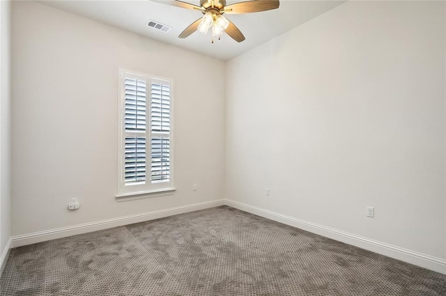 spare room featuring a ceiling fan, baseboards, visible vents, and carpet flooring