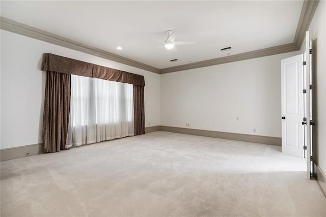 empty room featuring ceiling fan, ornamental molding, and light carpet