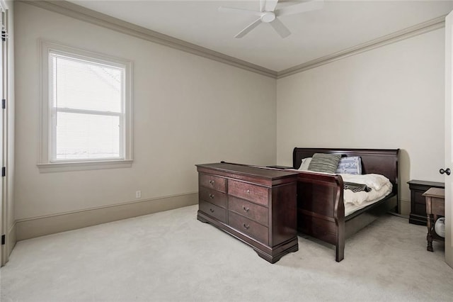 bedroom with light carpet, ceiling fan, and crown molding