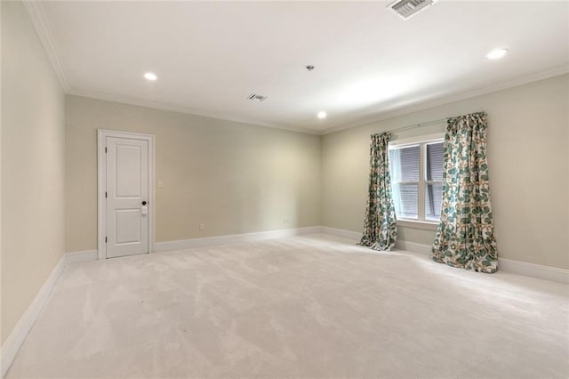 spare room with light colored carpet and ornamental molding