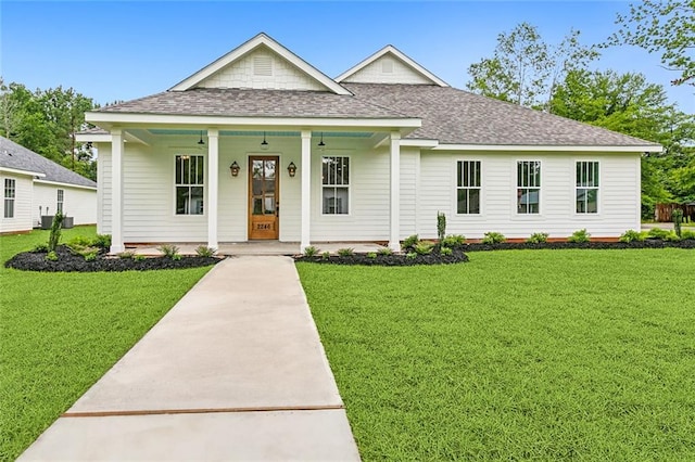 view of front of home featuring a front yard and covered porch