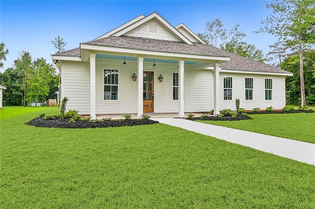 view of front of property featuring a porch and a front lawn