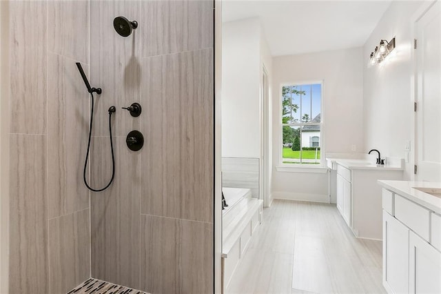 bathroom with vanity and plus walk in shower