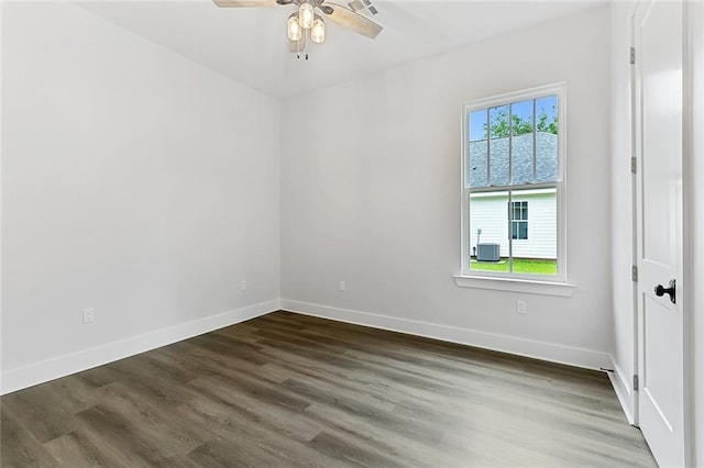 spare room with dark wood-type flooring and ceiling fan