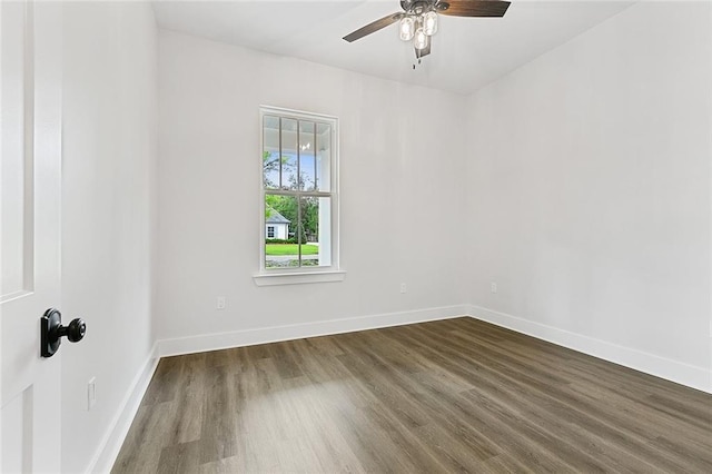 empty room with hardwood / wood-style floors and ceiling fan