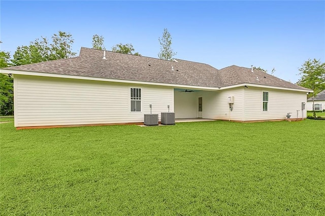 back of property featuring a yard, a patio area, and central AC