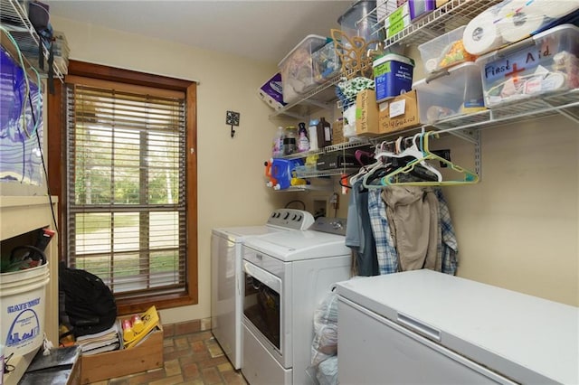 laundry room featuring washing machine and clothes dryer