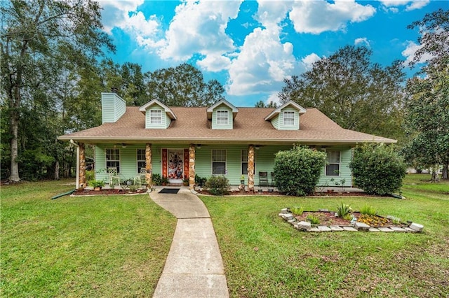39523 E Porter River Rd, Pearl River, LA 70452 - view of front of home with a porch, a chimney, and a front yard