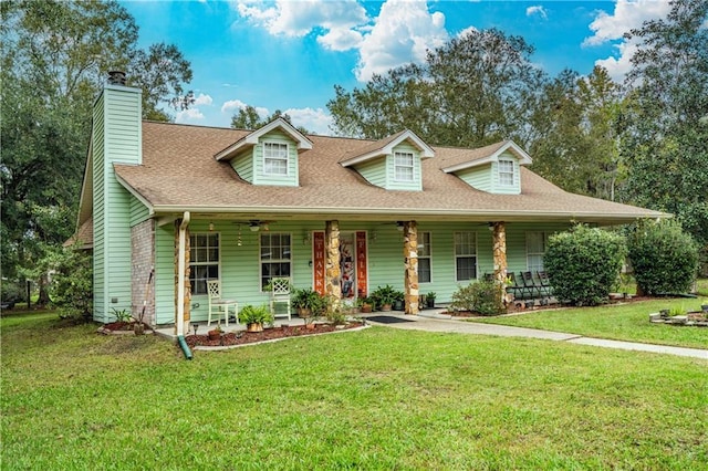 39523 E Porter River Rd, Pearl River, LA 70452 - view of front facade featuring covered porch, ceiling fan, and a front lawn