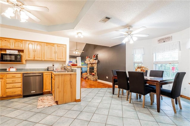 kitchen featuring light tile patterned floors, ceiling fan, a textured ceiling, stainless steel dishwasher, and sink