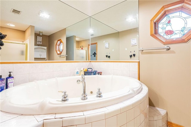 39523 E Porter River Rd, Pearl River, LA 70452 - bathroom featuring a tub with jets and a stall shower