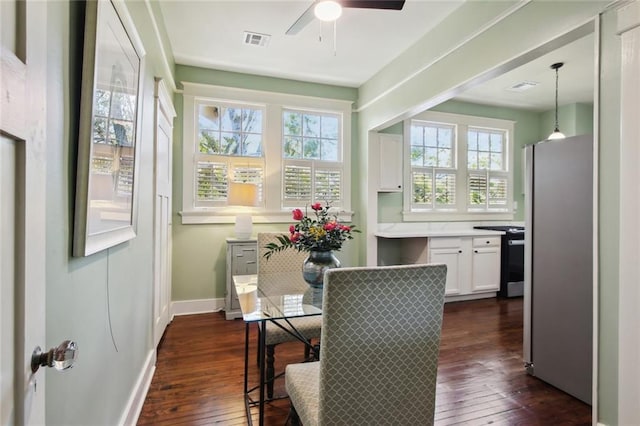 sunroom / solarium featuring plenty of natural light and ceiling fan