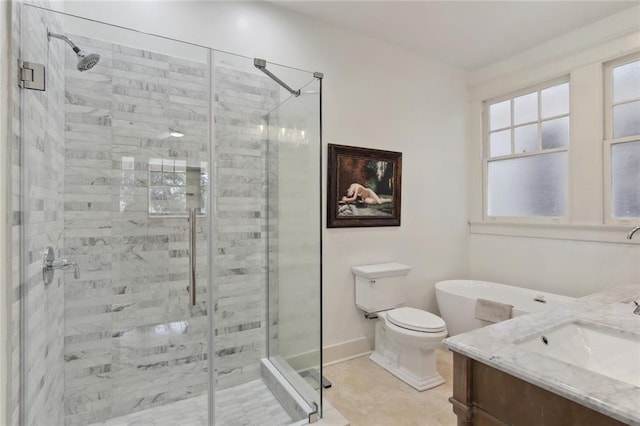 bathroom featuring toilet, vanity, and a shower with shower door