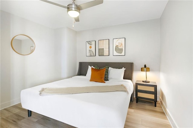 bedroom with wood-type flooring and ceiling fan