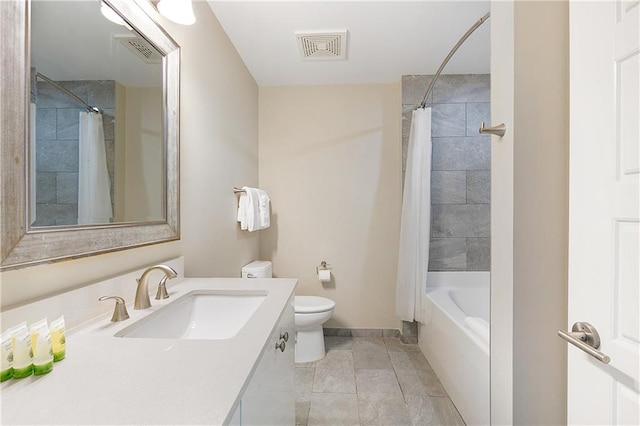 full bathroom with shower / tub combo with curtain, vanity, toilet, and tile patterned floors