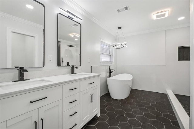 bathroom with vanity, crown molding, tile patterned floors, and separate shower and tub