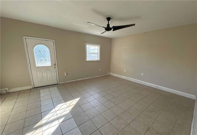 entryway featuring ceiling fan and light tile patterned flooring