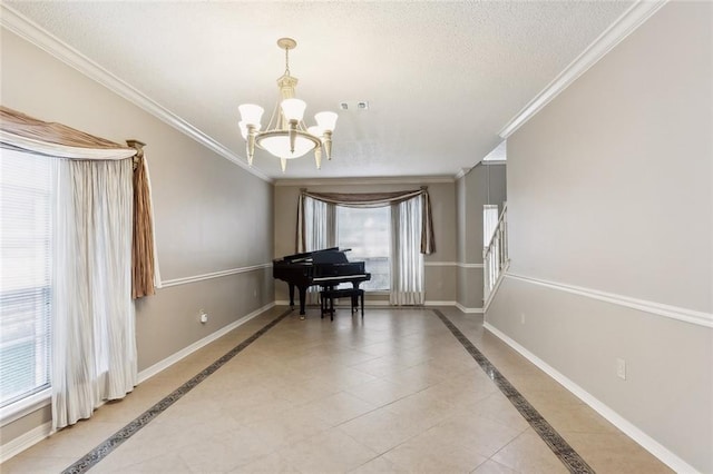 misc room featuring a notable chandelier, a textured ceiling, crown molding, and a wealth of natural light