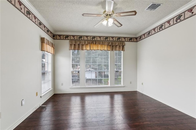 empty room with crown molding, dark hardwood / wood-style floors, a textured ceiling, and ceiling fan