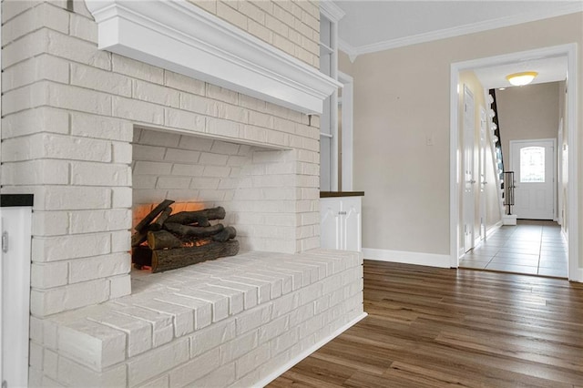 details featuring ornamental molding and hardwood / wood-style flooring