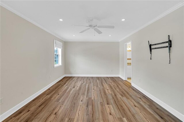 spare room featuring ceiling fan, light hardwood / wood-style floors, and ornamental molding