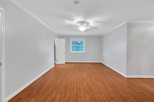 spare room with ceiling fan, light hardwood / wood-style floors, and ornamental molding